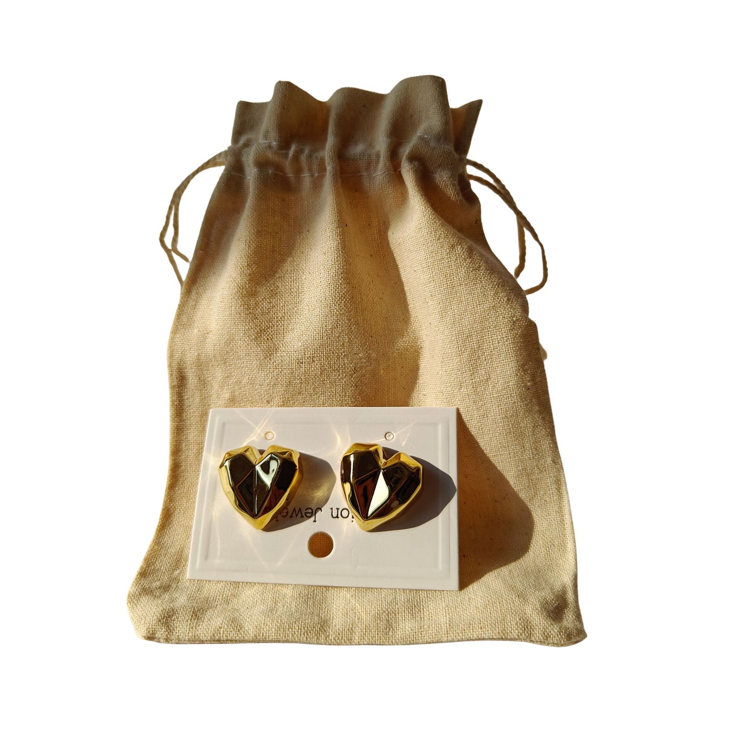 Gold tone geometric pattern tarnish free, hypoallergenic heart shaped studs with a jute pouch jewelry