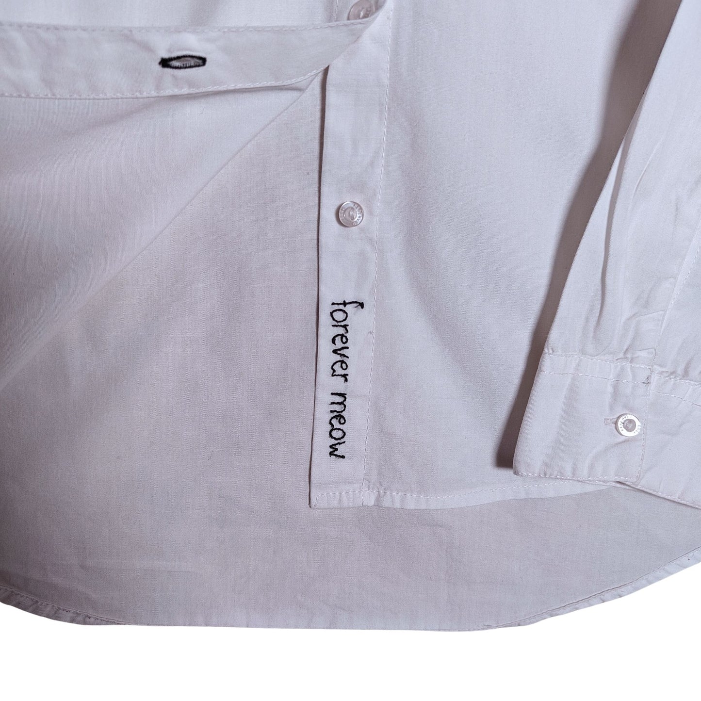 'Forever Meow' in seam embroidery close up